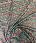 Green-brown woven mesh fabric with intricate texture for crafting and upholstery projects