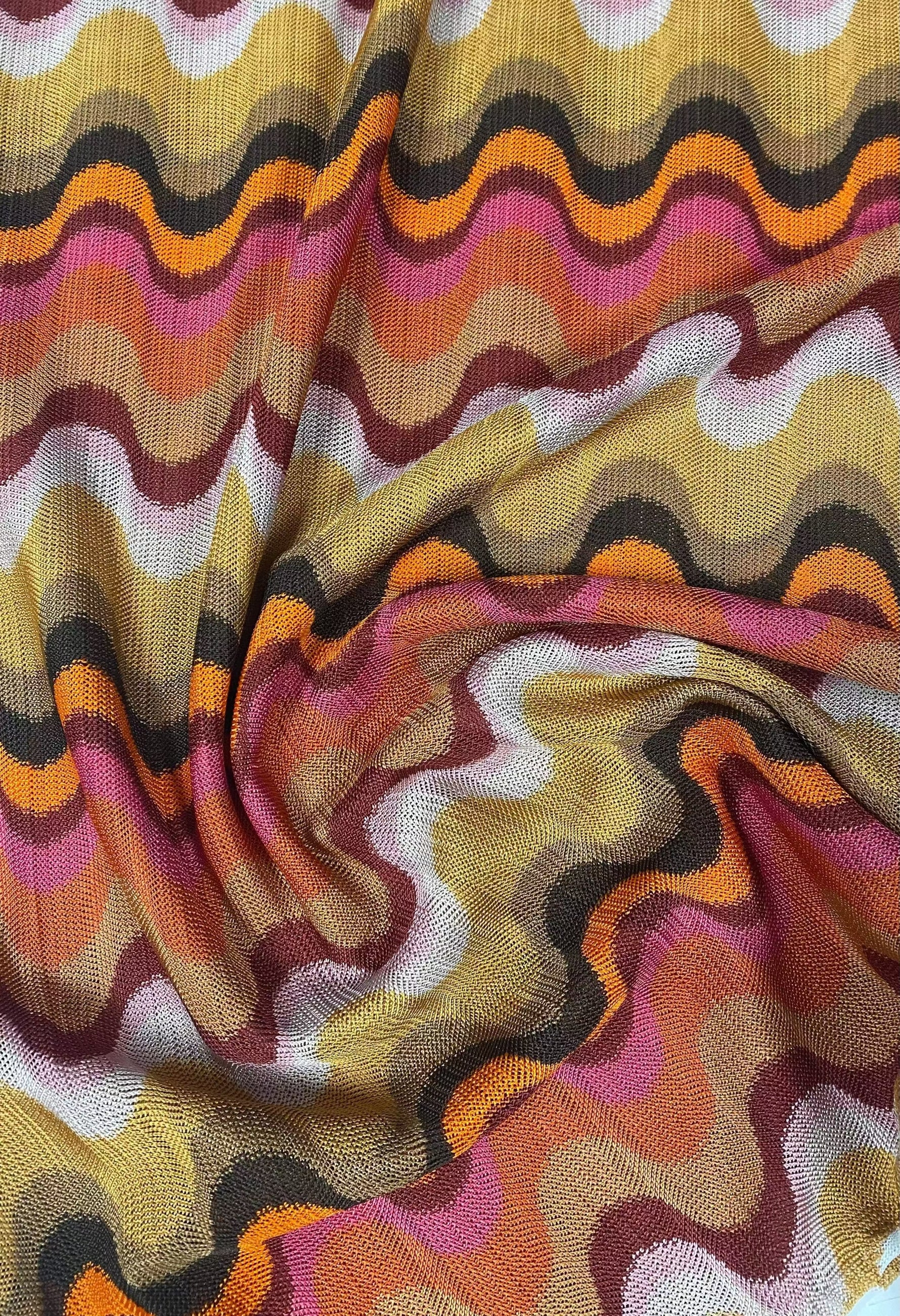Retro wavy mesh fabric with colorful wave pattern for fashion and craft projects