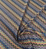 Colorful zigzag knitted mesh fabric with vibrant multicolor pattern and lightweight breathable texture for creative projects