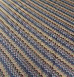 Colorful zigzag knitted mesh fabric with vibrant multicolor pattern for creative sewing projects