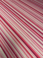 Close-up of Shimmer Fabric Ottoman with pink and white striped 4-way stretch design and shimmering finish