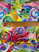Colorful abstract floral swirl fabric with vibrant multicolored pattern and ruler for scale