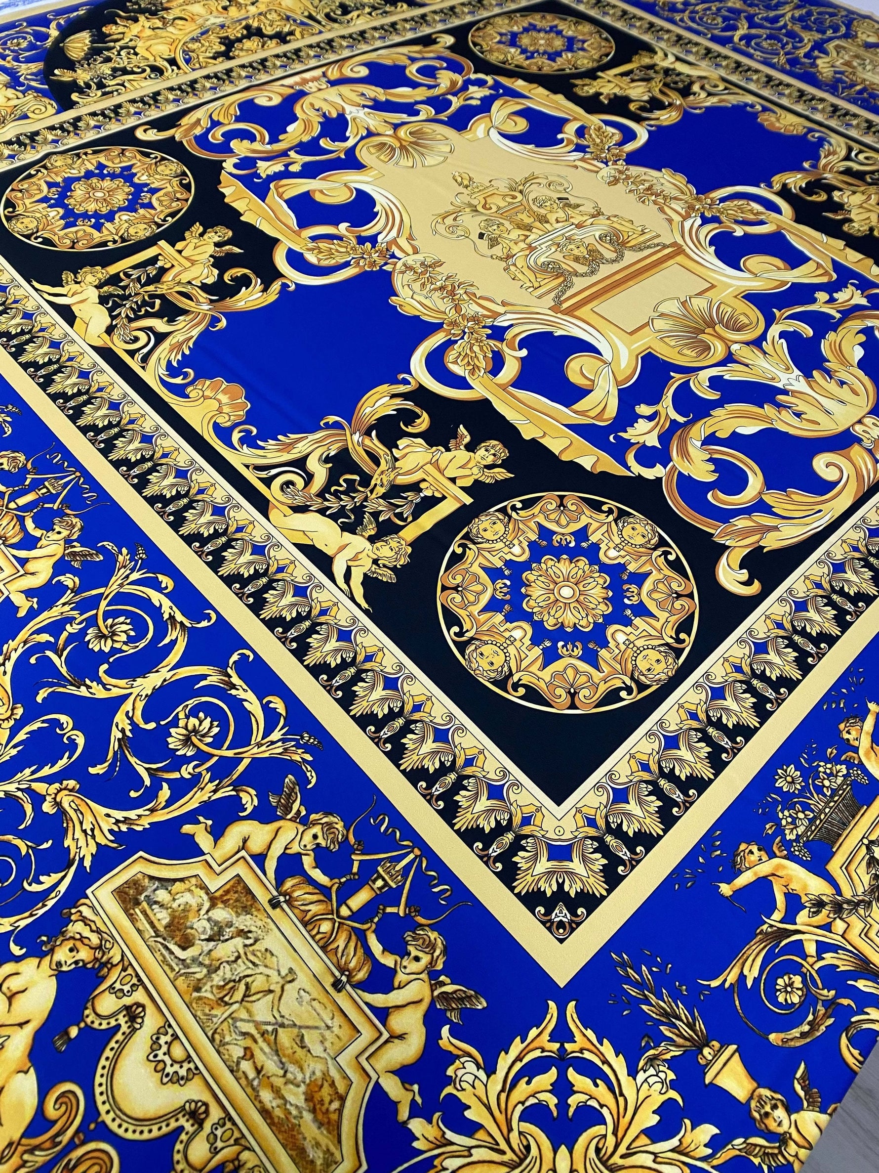 royal blue baroque fabric with intricate gold patterns and ornamental design suitable for upholstery and drapery