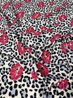 Leopard print fabric with red pink lip pattern for upholstery and home decor projects
