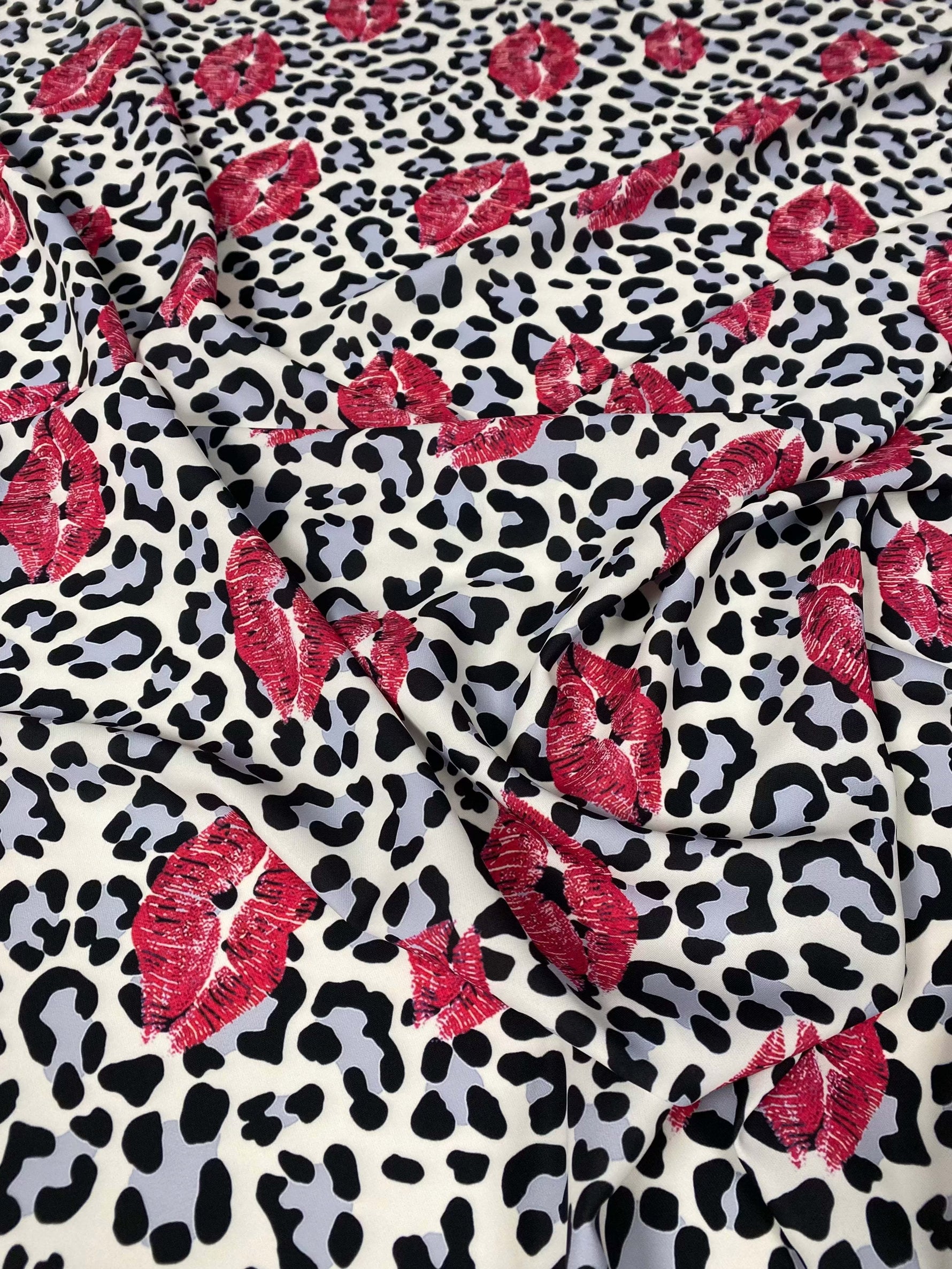 Leopard print fabric with red pink lip pattern for upholstery and home decor projects