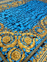 Turquoise snake skin fabric with gold baroque pattern for stylish fashion and upholstery designs