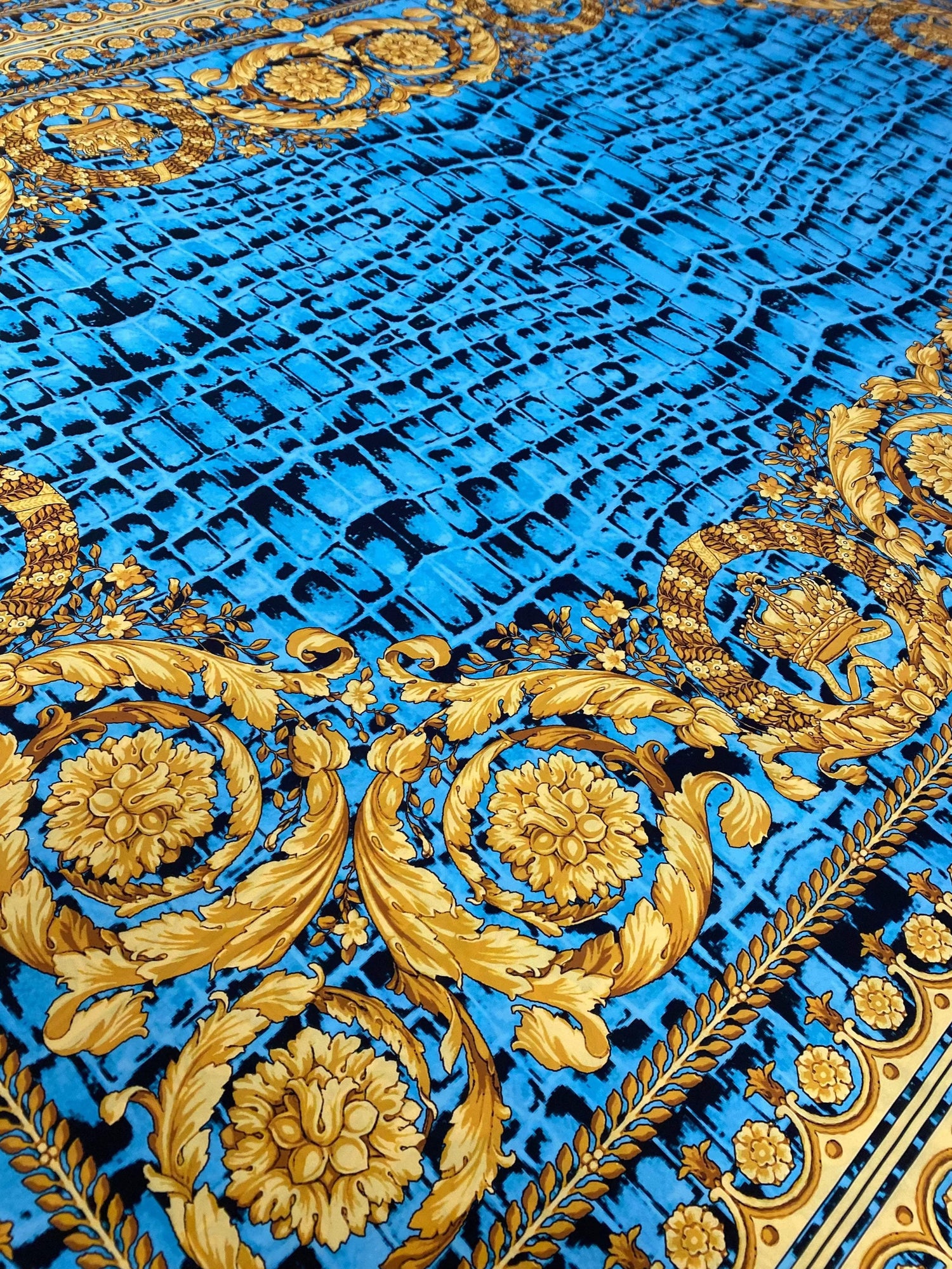 Turquoise snake skin fabric with gold baroque pattern for stylish fashion and upholstery designs
