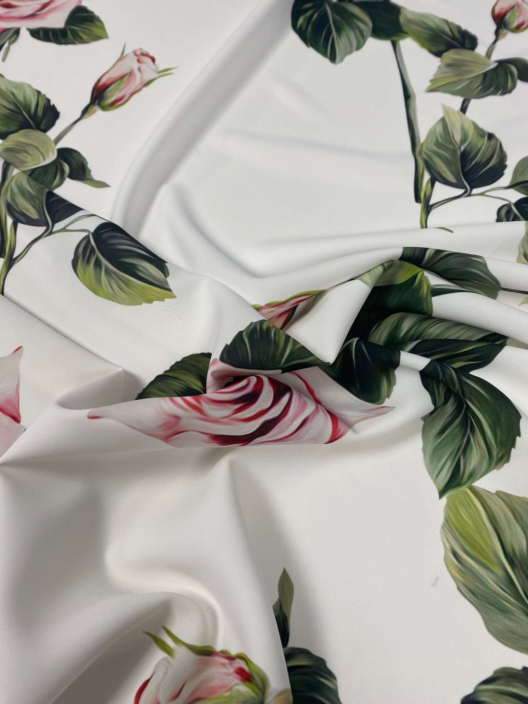 Pink Rose White Pattern floral fabric with pink roses and green leaves on a white background, soft and durable textile for sewing and crafts.