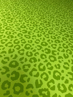 neon green leopard print fabric with bold animal pattern and 150cm width for clothing and decor projects