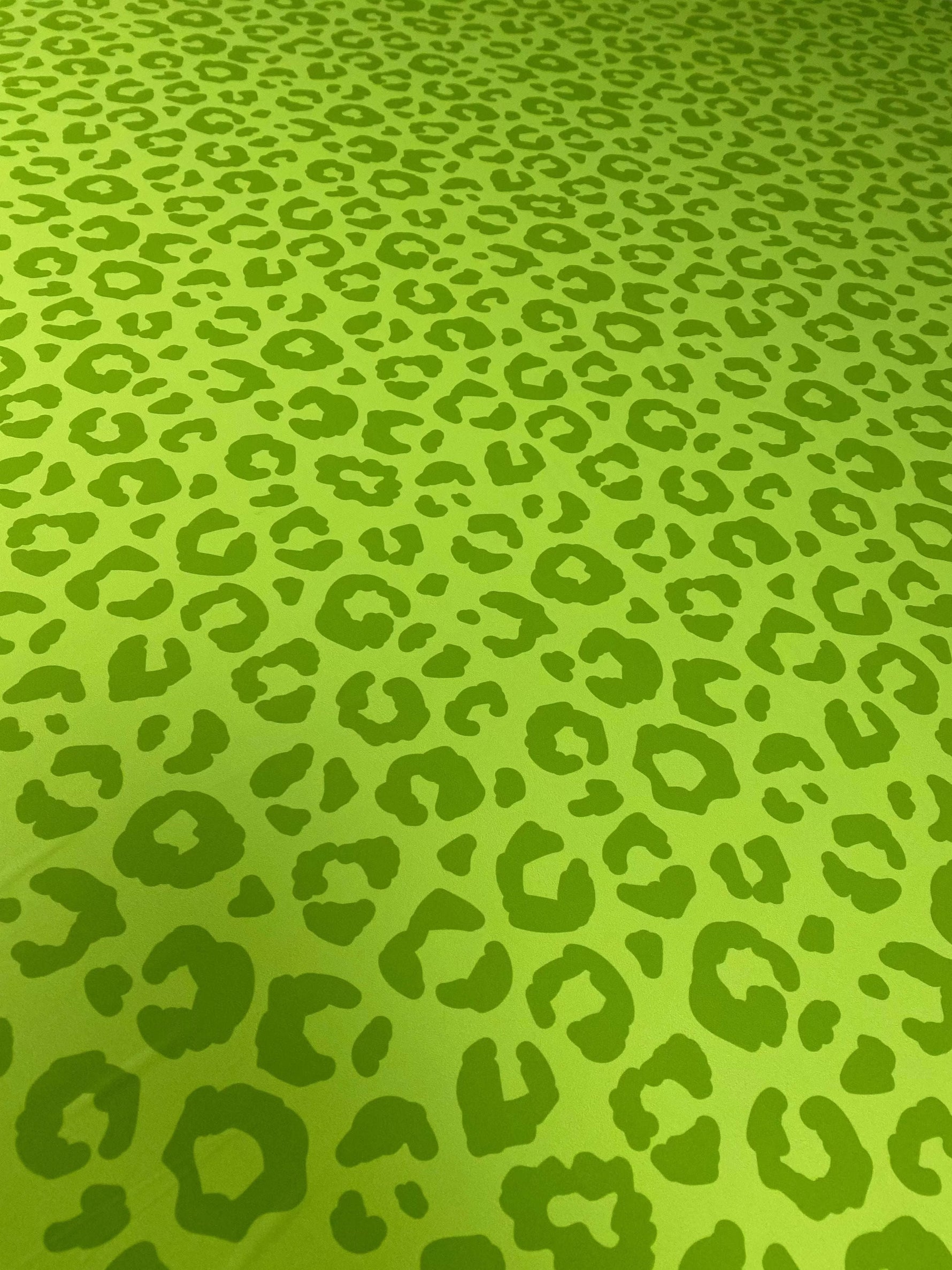 neon green leopard print fabric with bold animal pattern and 150cm width for clothing and decor projects