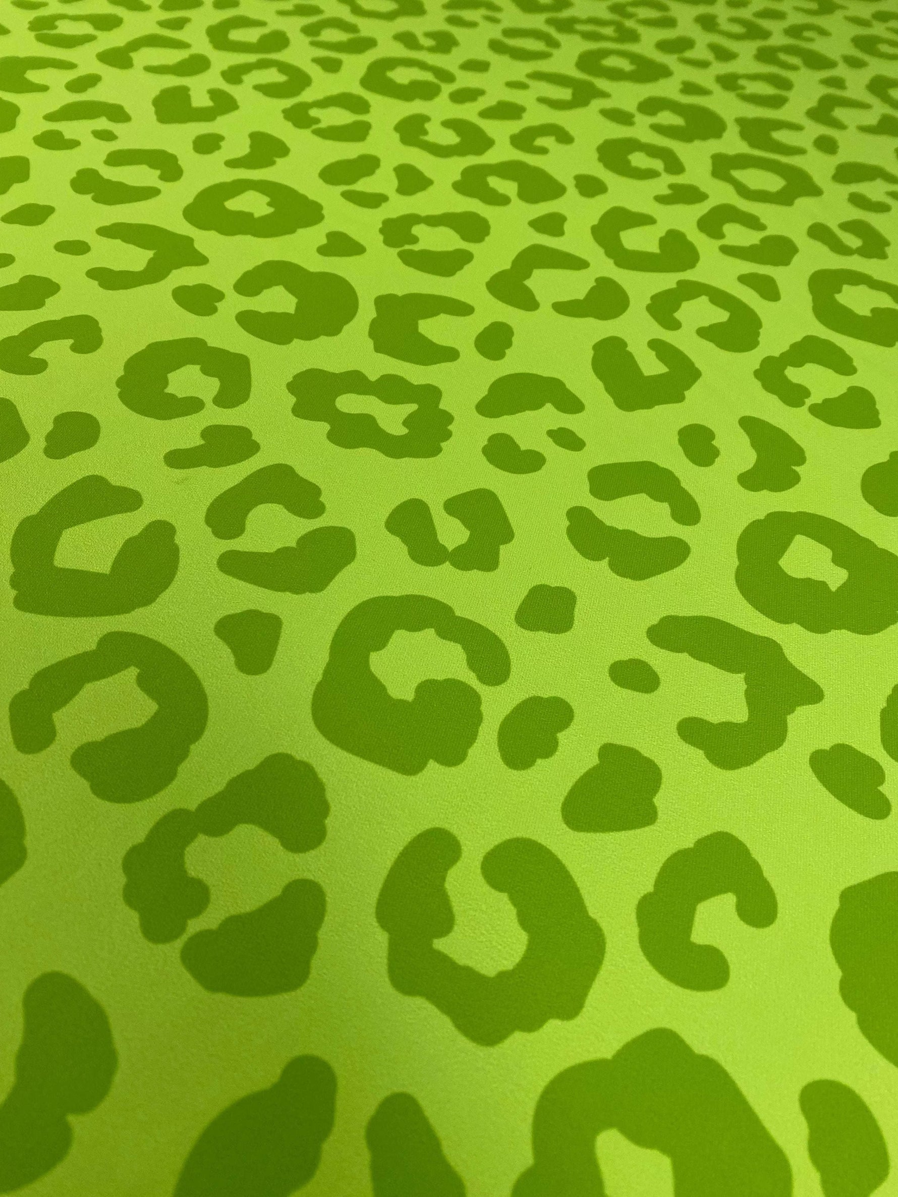 neon green leopard print fabric with bold animal pattern in vibrant green tones