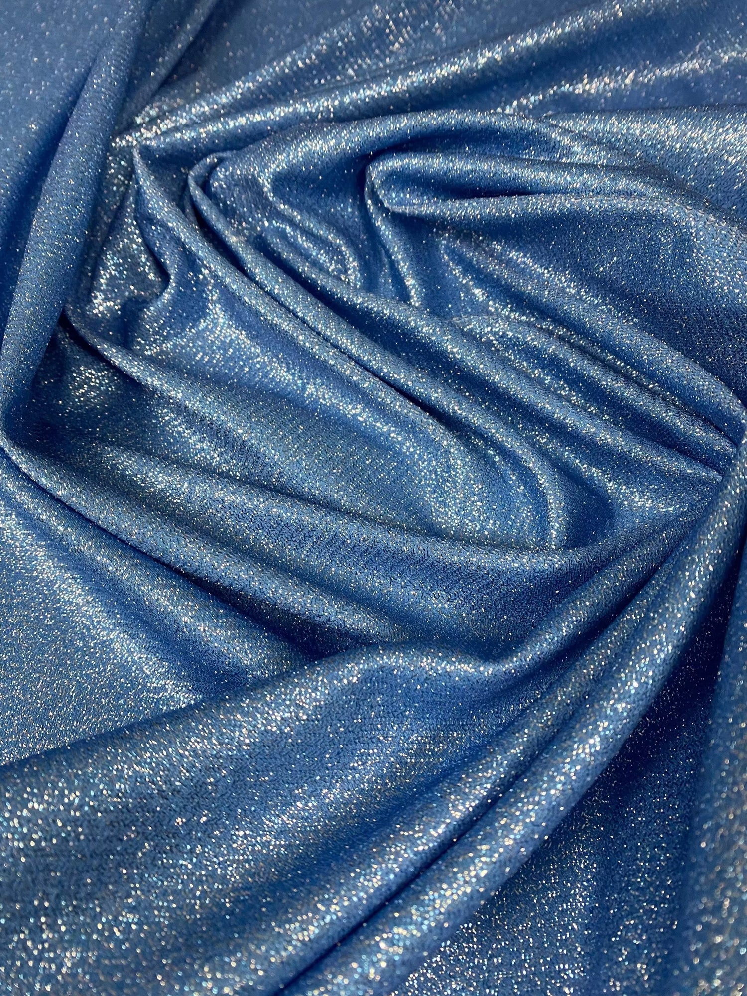 Sky blue glitter lurex fabric with shimmering glitter and 4-way stretch spandex blend