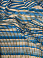 Blue striped shimmer ottoman fabric with gold lurex stripes and 4-way stretch for activewear and costumes