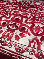 Red Baroque pattern linen fabric with intricate red floral and ornamental designs on white background for upholstery and crafts