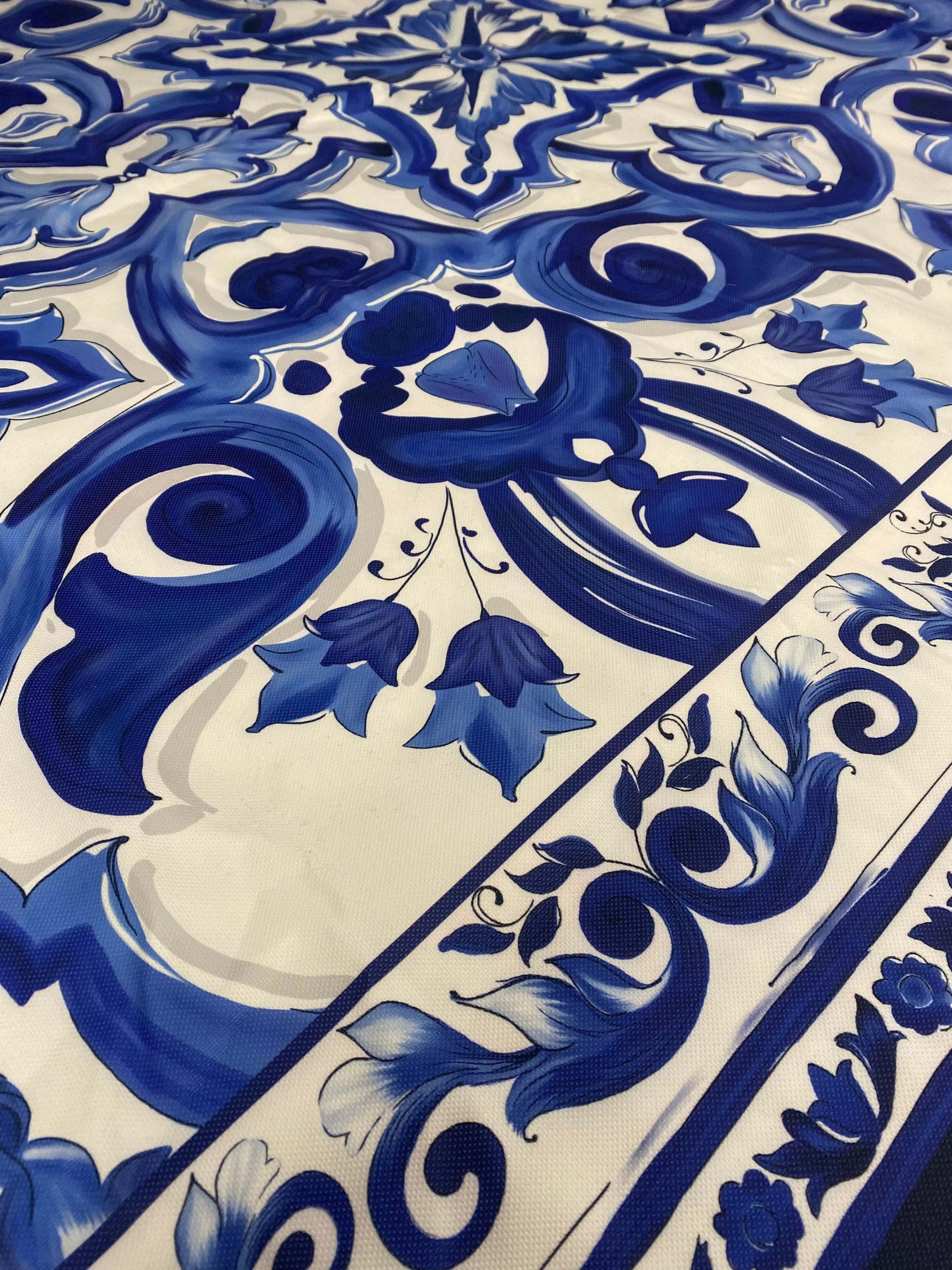 Close-up of Büyük Mojalica Design blue and white patterned upholstery fabric with intricate floral and swirl motifs