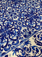 Close-up of blue and white floral patterned upholstery fabric with intricate Mavi design and decorative motifs