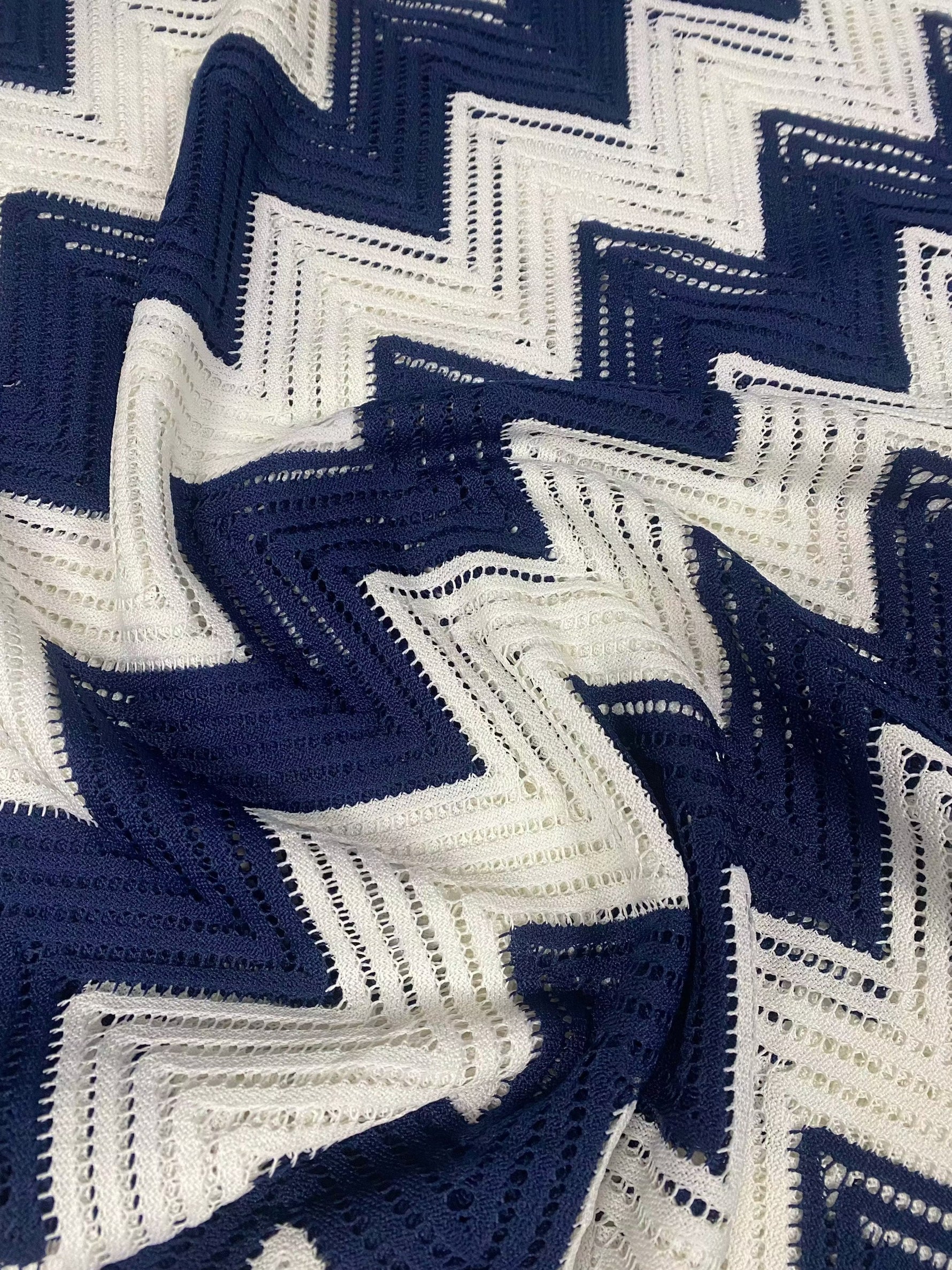 White and navy zigzag patterned breathable mesh fabric for fashion and craft projects