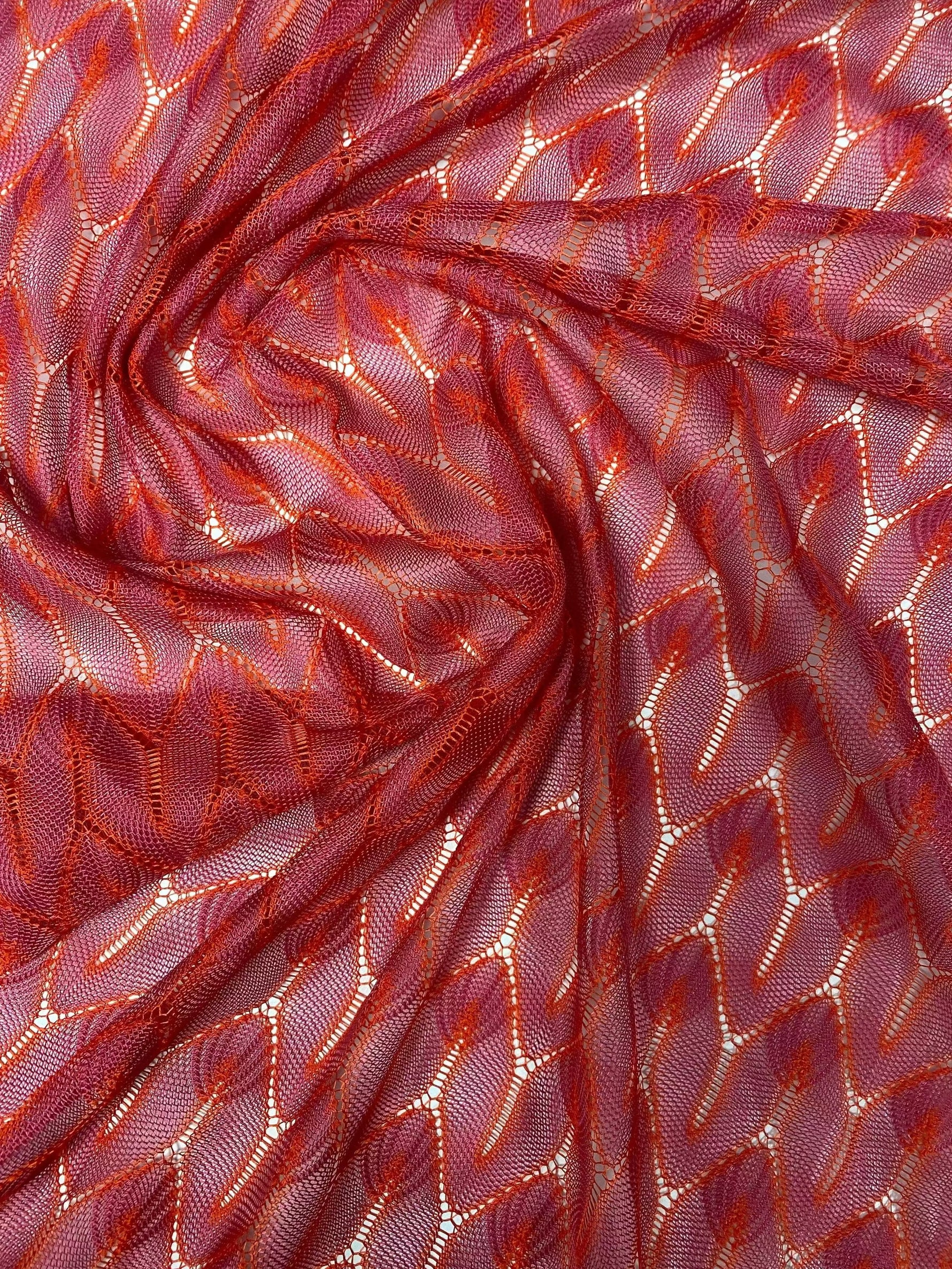 Soft stretchy zigzag knit jersey fabric in red for apparel and crafts