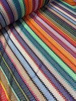 Colorful knit mesh fabric with vibrant zigzag striped pattern in multiple colors and textures