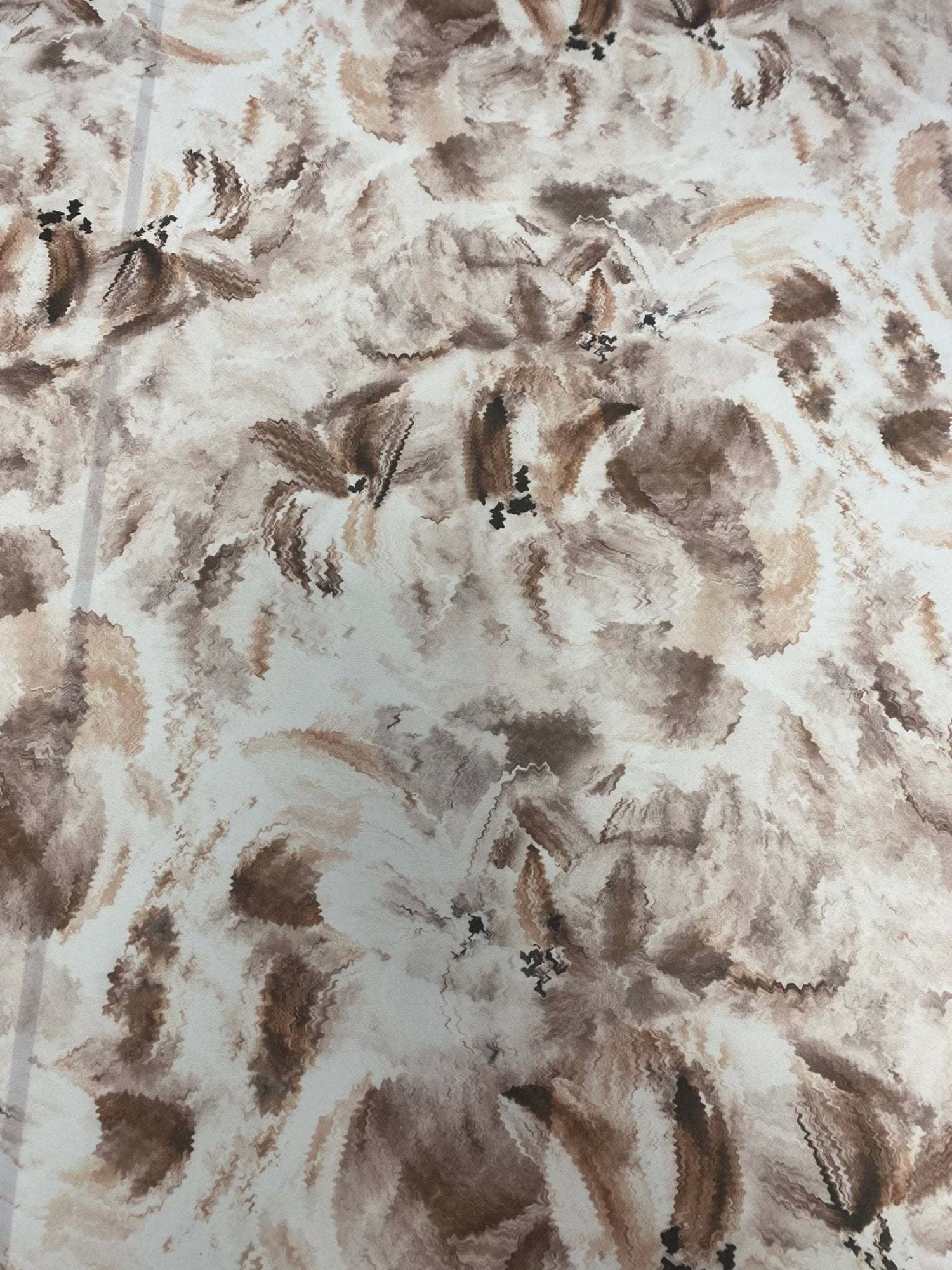 abstract brown floral fabric with soft, warm-toned flowers and leaves pattern on a light background