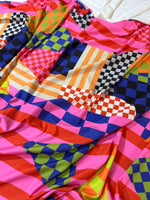 Multicolor abstract geometric fabric with vibrant checkered and striped patterns, 150cm wide, ideal for quilting and upholstery projects