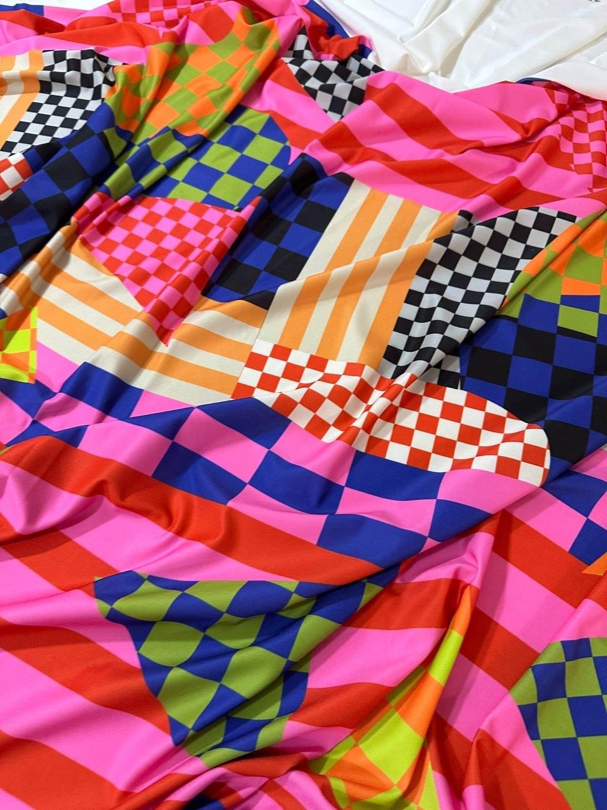 Multicolor abstract geometric fabric with vibrant checkered and striped patterns, 150cm wide, ideal for quilting and upholstery projects