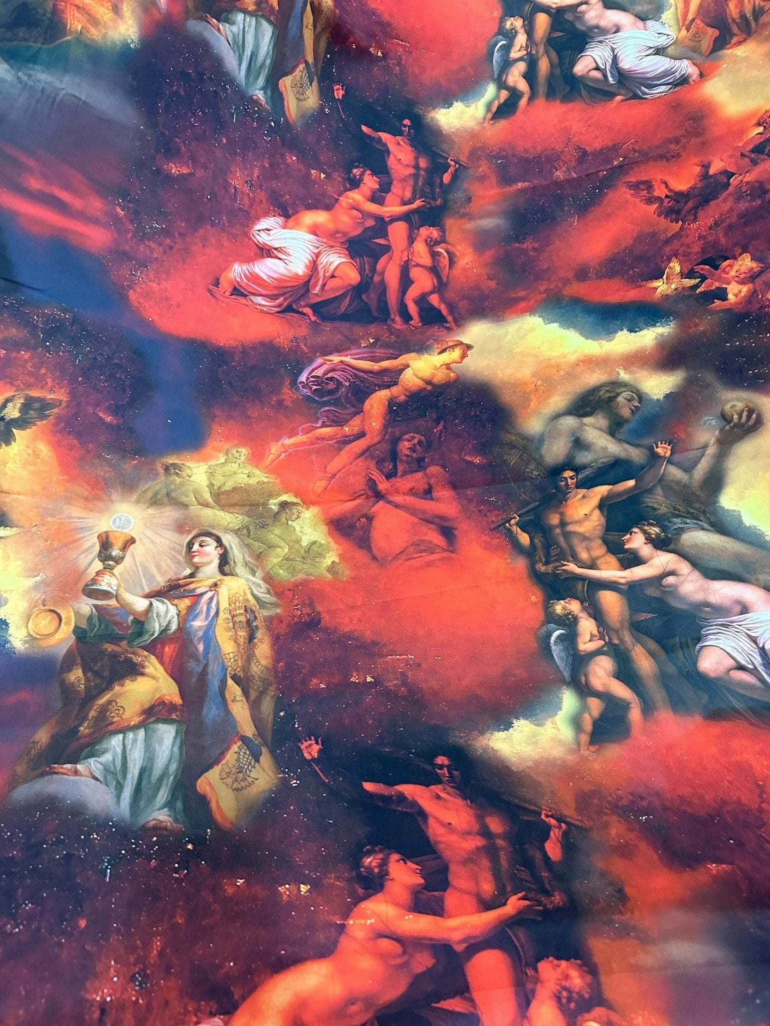 Vintage antique angel fabric with detailed classical angelic figures and vibrant red and blue hues