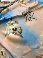 Angel Print Sky Blue Fabric with whimsical angel and cloud pattern on soft textile