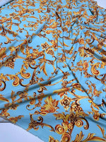 Baby blue fabric with intricate gold baroque print designs by the yard