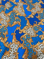 Baroque leopard print fabric with blue background and ornate gold scroll design