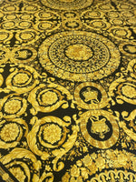 Baroque black and gold upholstery fabric with ornate floral and medallion patterns on 150cm wide material