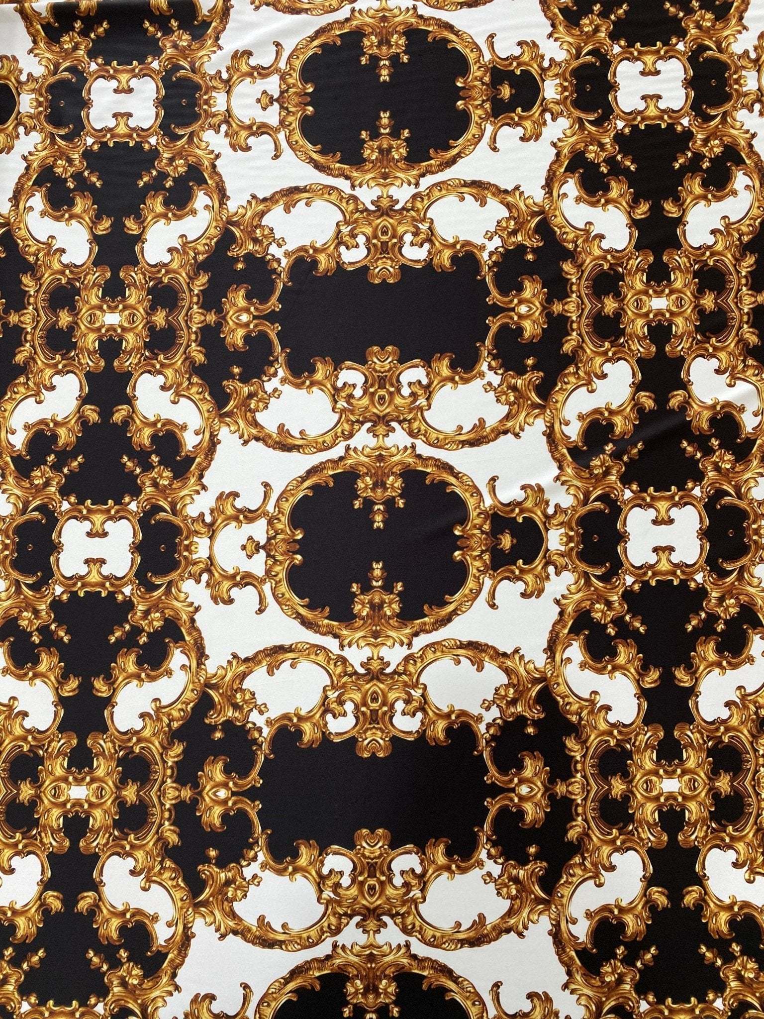 Baroque fabric with black, white, and gold ornate pattern for elegant crafts
