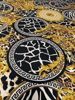 Baroque Greek Key Fabric with black, gold, and animal print patterns featuring elegant Greek key motifs and baroque designs