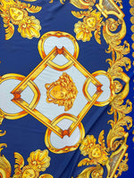 Baroque gold pattern fabric with intricate gold designs on royal blue background, ideal for upholstery and drapery.
