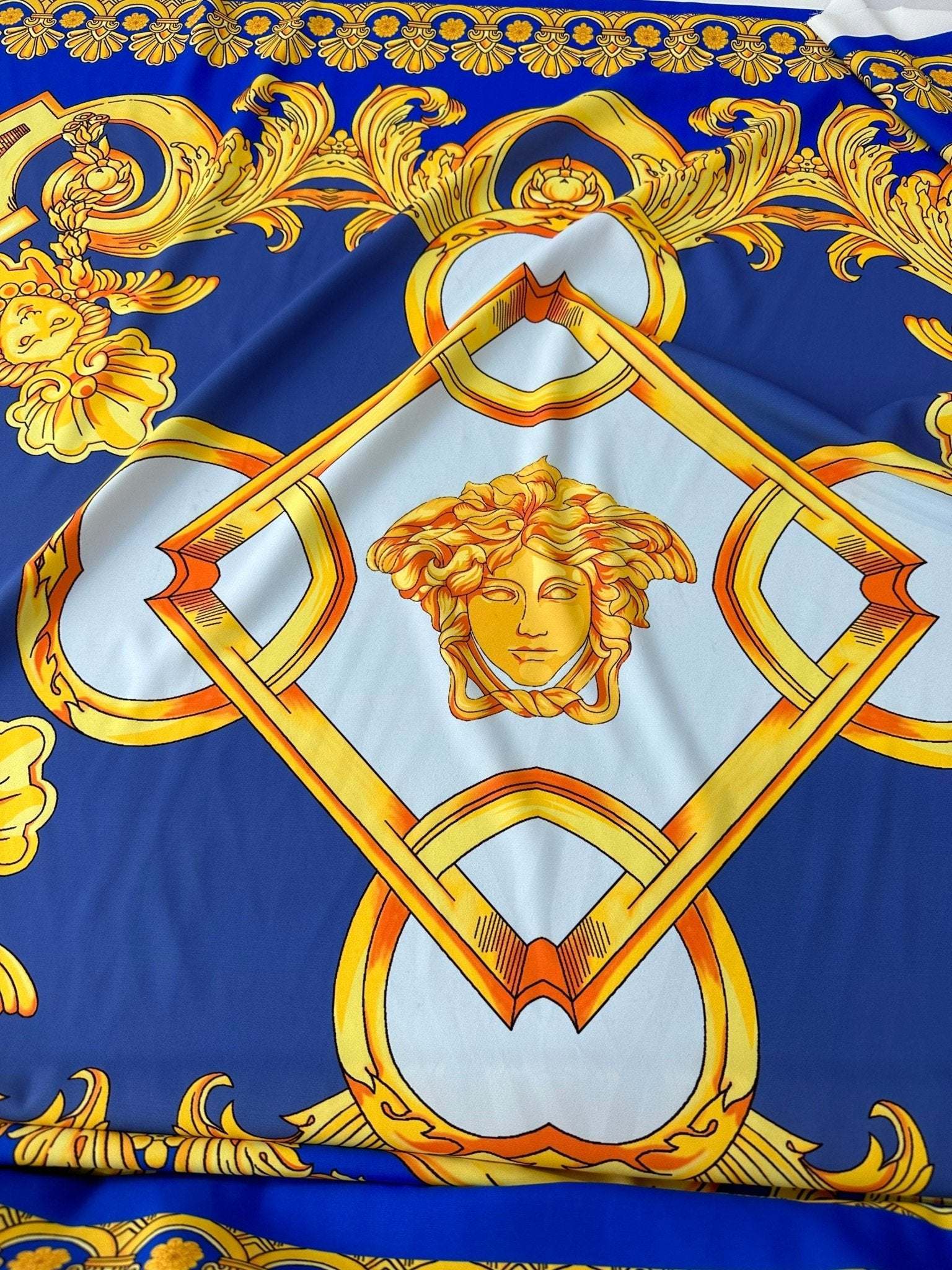 Baroque gold pattern fabric with intricate gold designs on royal blue background, 150cm wide ideal for upholstery and drapery