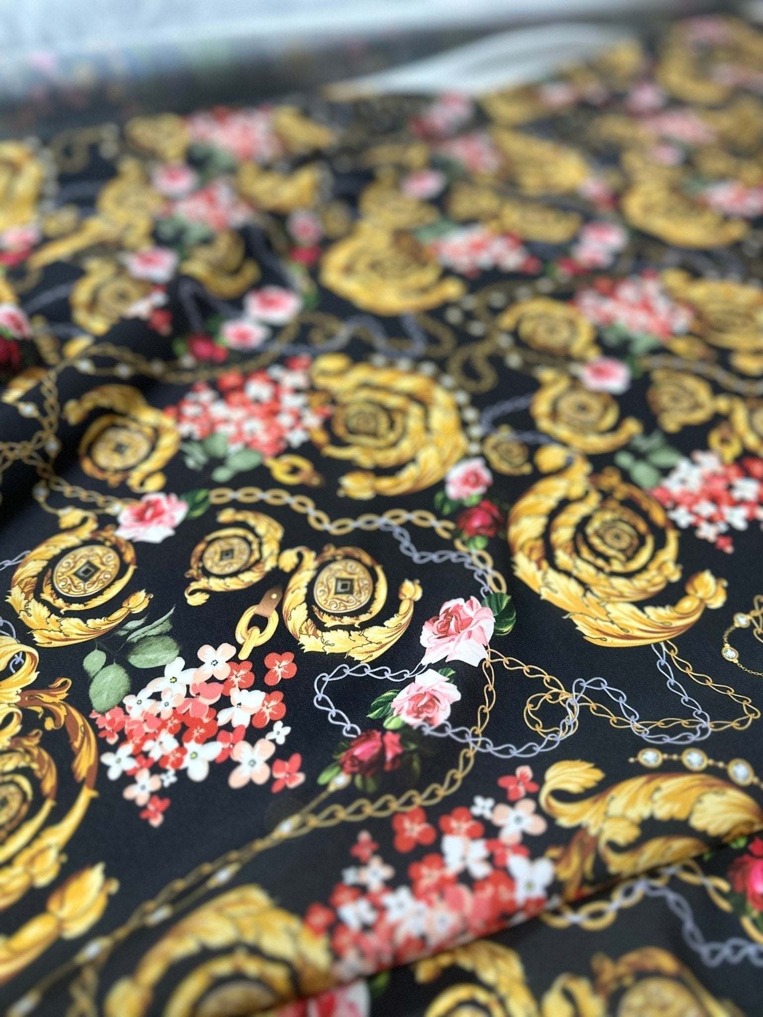 Baroque Floral Chain Fabric with gold ornate patterns, floral details, and chain motifs on black background