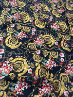 Baroque floral chain fabric with gold ornamental patterns and colorful flowers on black background