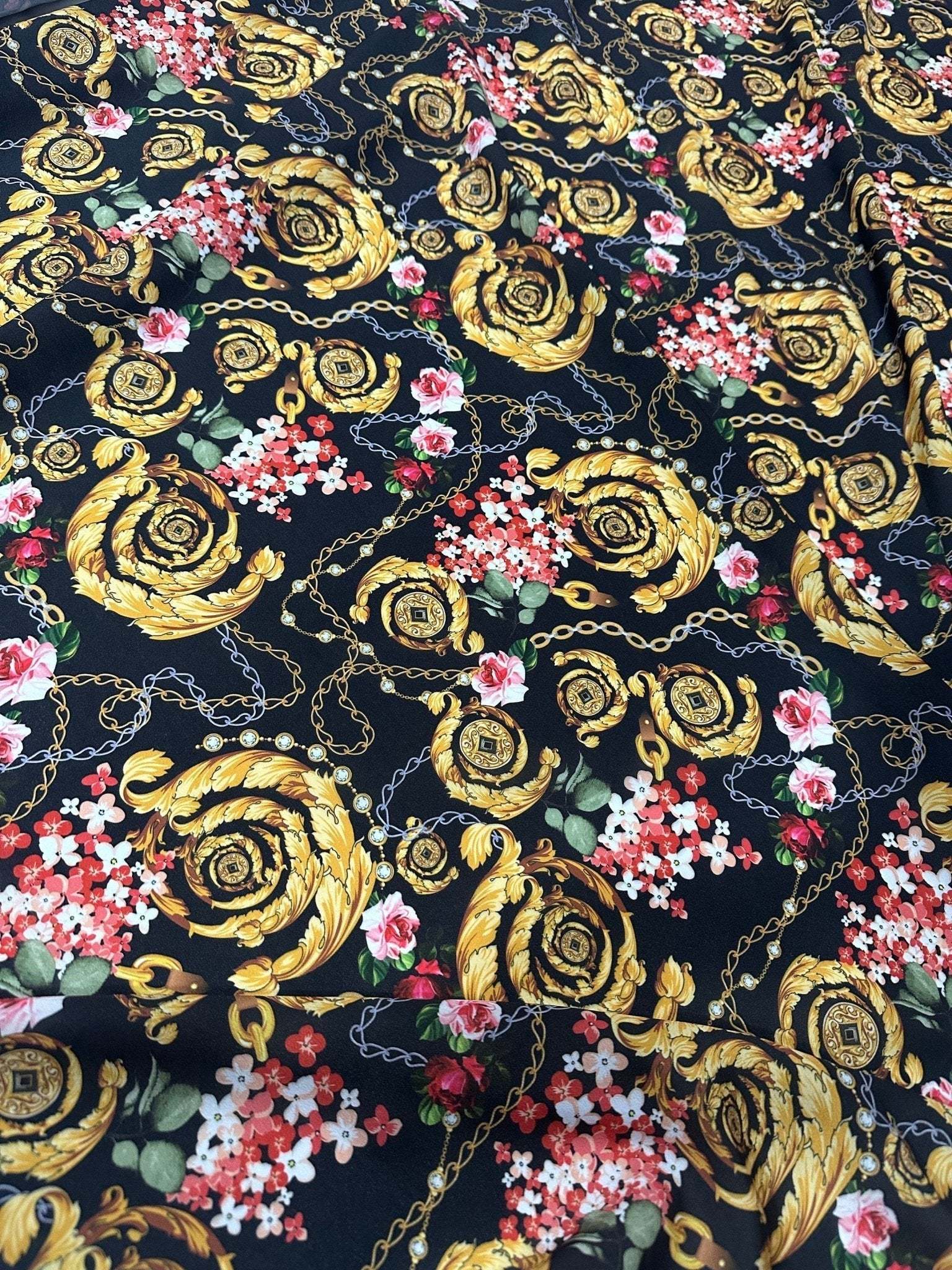 Baroque floral chain fabric with gold ornamental patterns and colorful flowers on black background