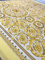Elegant Baroque gold and white patterned fabric suitable for upholstery and drapery projects