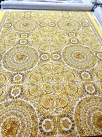 Baroque gold and white fabric with intricate patterned design, ideal for upholstery and drapery projects
