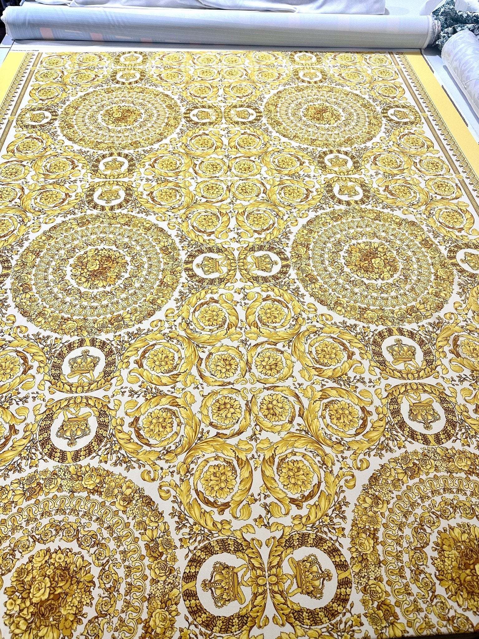 Baroque gold and white fabric with intricate patterned design, ideal for upholstery and drapery projects