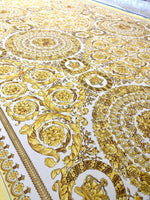 Baroque gold and white fabric with intricate ornate circular patterns and floral designs, suitable for upholstery and drapery projects