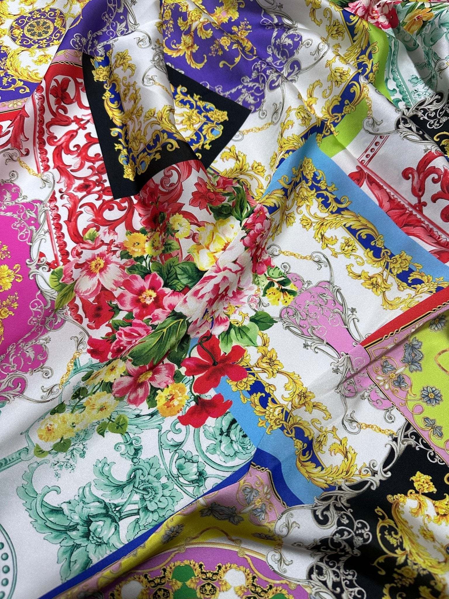 Multicolor Baroque pattern fabric with intricate gold detailing and floral accents, ideal for upholstery, clothing, and crafts.