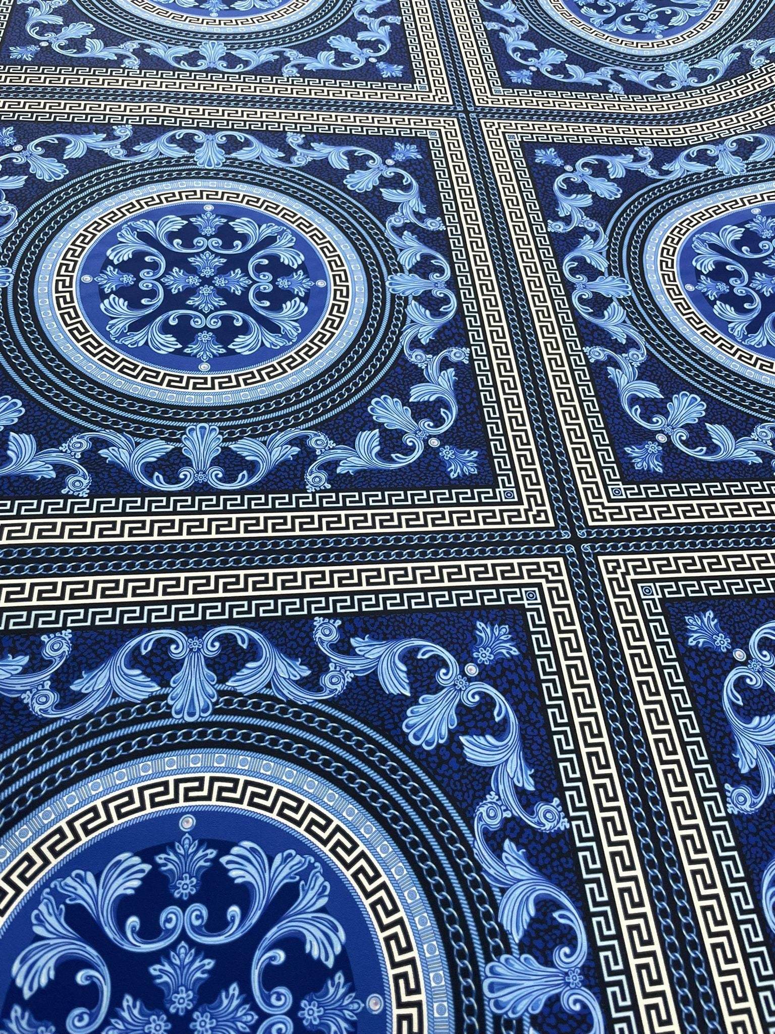 Navy blue baroque fabric with intricate Greek key and floral patterns in a luxurious design