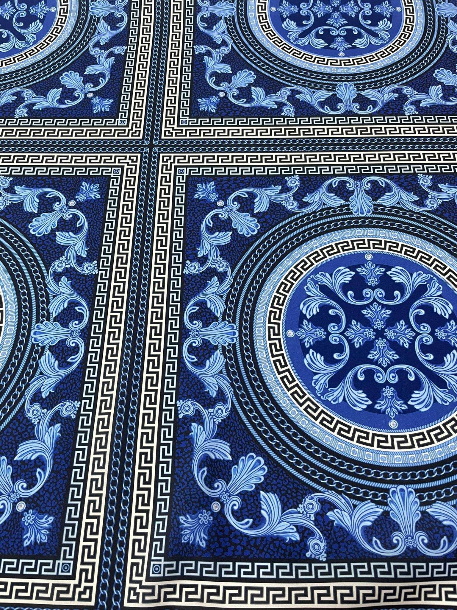 Navy blue Baroque fabric with intricate Greek key and floral patterns, ideal for upholstery and drapery.