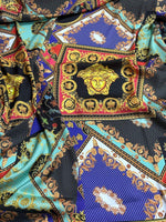 Baroque patchwork fabric with intricate gold, blue, turquoise, and black decorative patterns and medallion motifs