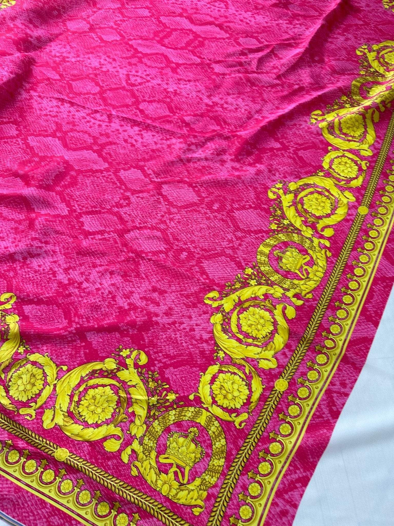 Baroque pink satin fabric with gold ornate border and silky sheen texture