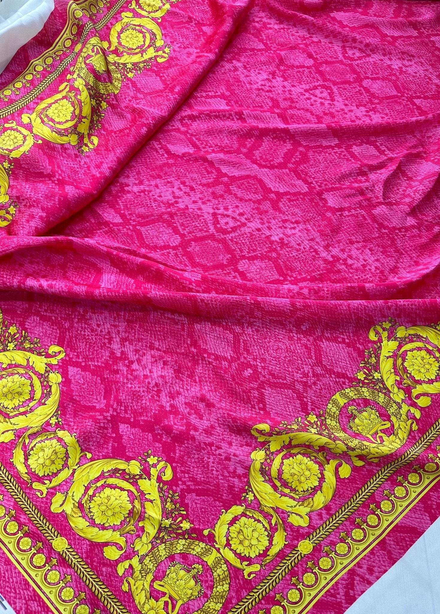 Baroque pink satin fabric with yellow ornate baroque pattern and silky texture