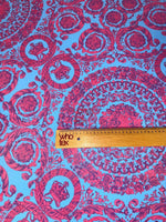 Purple and blue Baroque pattern fabric with intricate circular designs and a ruler for scale on 150cm wide material