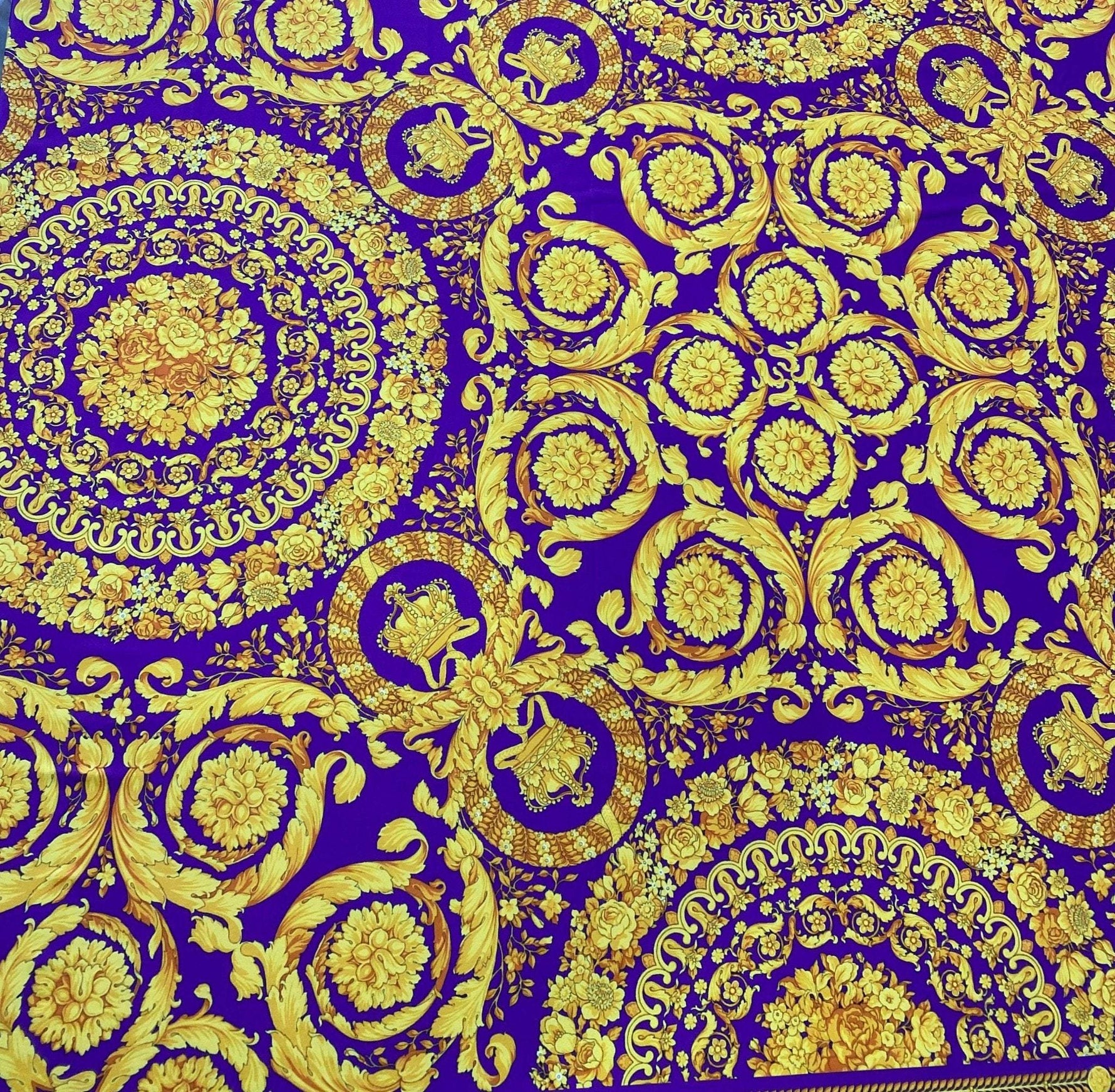 Purple Baroque pattern fabric with intricate gold floral and ornamental designs on a rich purple background, 150cm wide